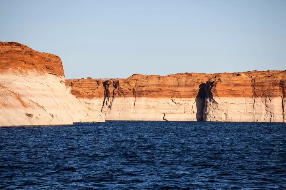 "Bathtub ring" showing low water level on red rocks at Lake Powell, Arizona